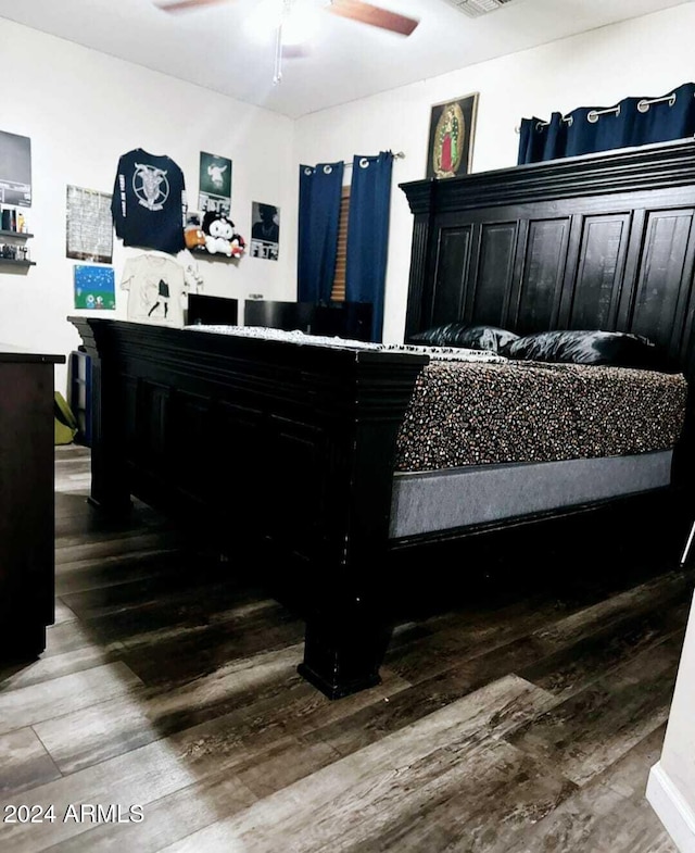 bedroom featuring hardwood / wood-style flooring and ceiling fan