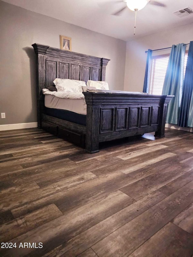 bedroom featuring dark hardwood / wood-style floors and ceiling fan