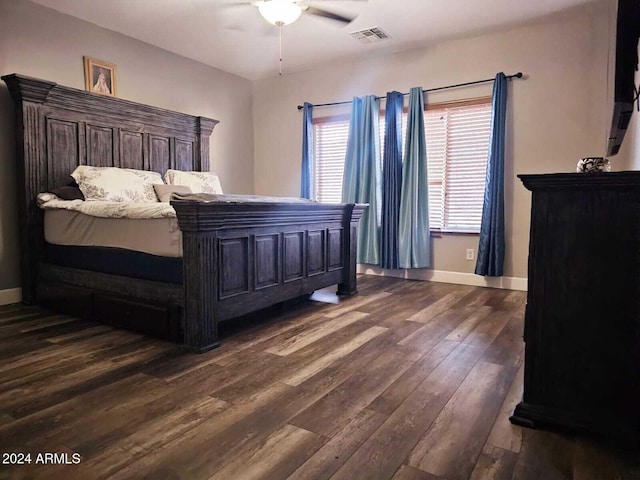 bedroom featuring ceiling fan and dark wood-type flooring