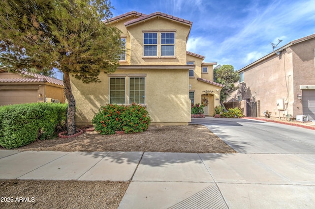 17374 W Adams St, Goodyear, AZ 85338 - view of front of property with driveway, stucco siding, and a tile roof