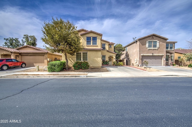 17374 W Adams St, Goodyear, AZ 85338 - view of front of property featuring concrete driveway, a garage, and stucco siding