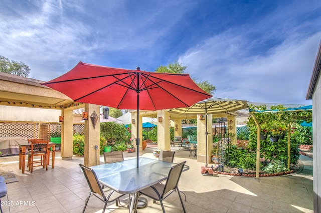 17374 W Adams St, Goodyear, AZ 85338 - view of patio with outdoor dining area and fence