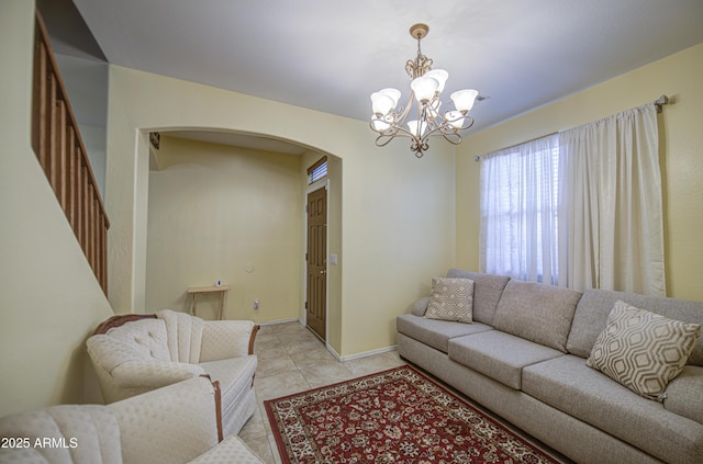 17374 W Adams St, Goodyear, AZ 85338 - living area with arched walkways, a chandelier, and light tile patterned floors