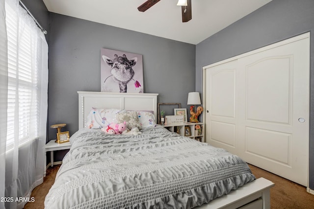 bedroom featuring ceiling fan and a closet