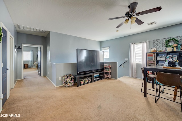 carpeted living room with a textured ceiling