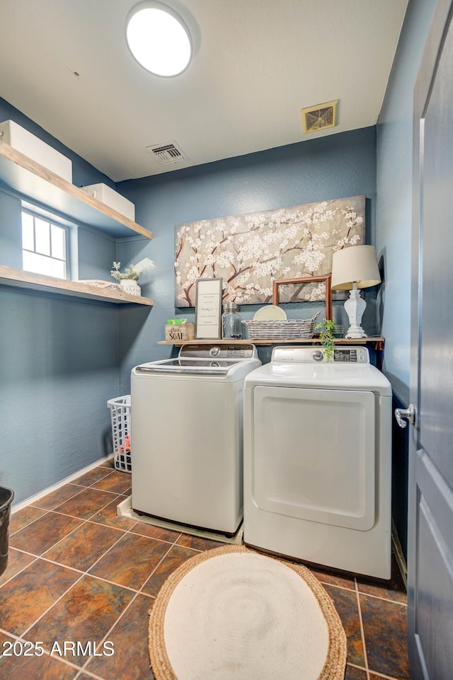 washroom with washing machine and dryer