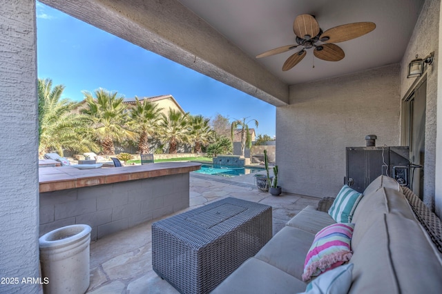 view of patio with an outdoor hangout area, an outdoor bar, and ceiling fan