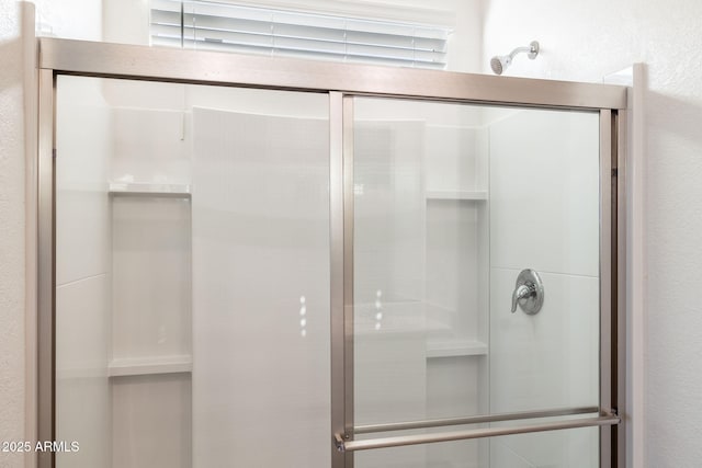 bathroom featuring an enclosed shower