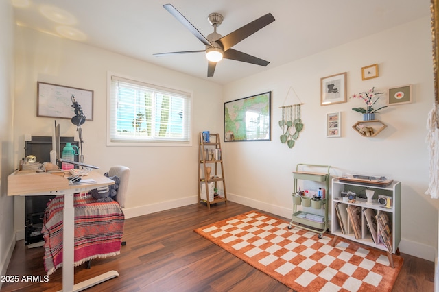 home office with dark hardwood / wood-style floors and ceiling fan