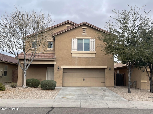 front of property with a garage