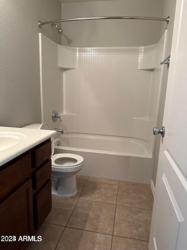 full bathroom featuring shower / bathing tub combination, tile patterned flooring, vanity, and toilet