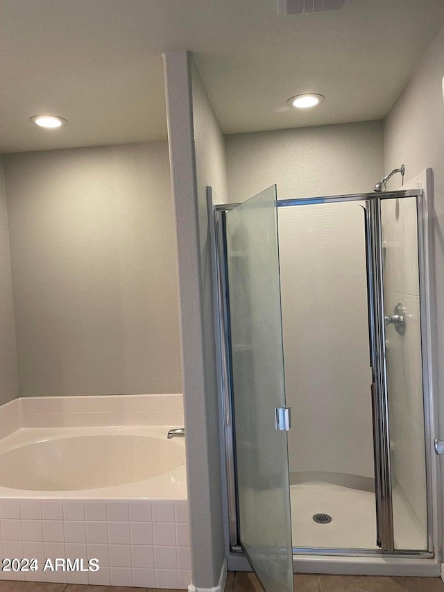 bathroom with separate shower and tub