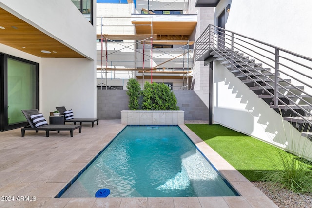 view of pool with a patio