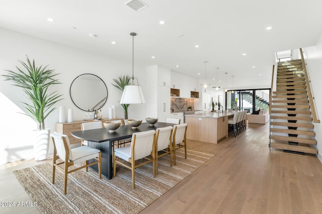 dining space featuring light hardwood / wood-style floors