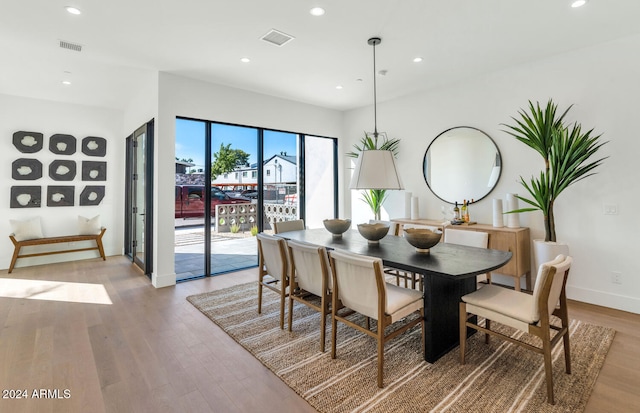 dining area with light hardwood / wood-style flooring