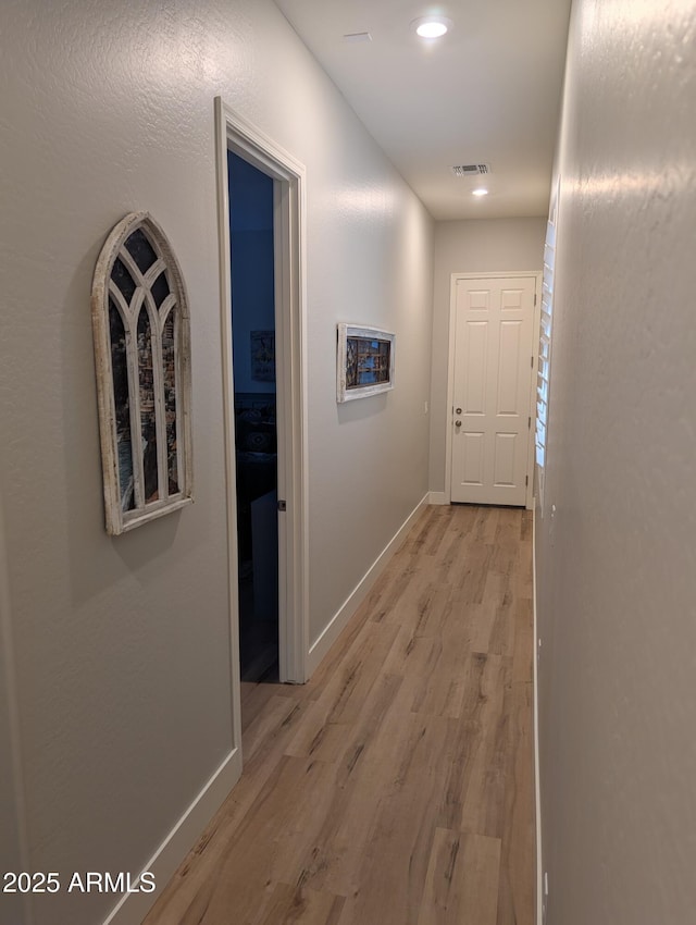 hallway featuring light hardwood / wood-style flooring