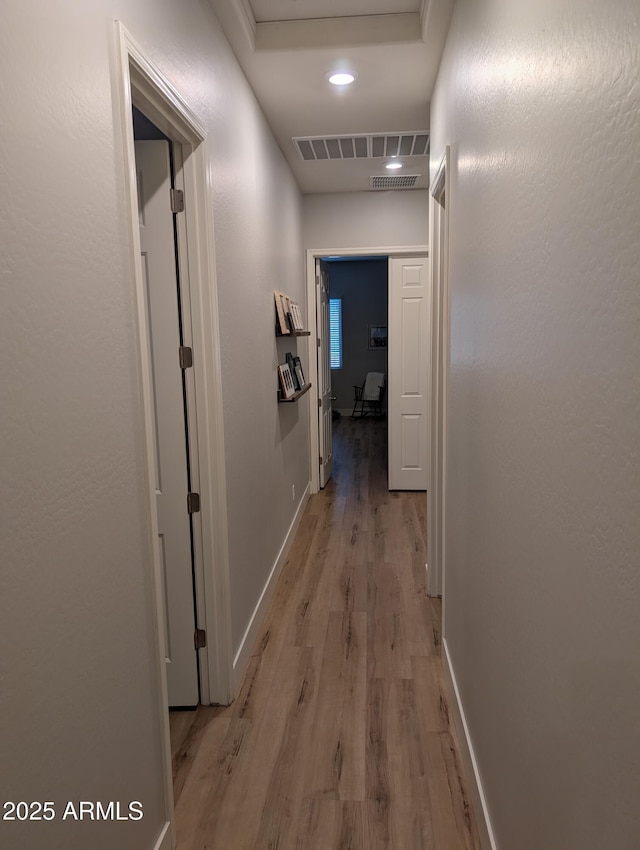 hallway with light wood-type flooring