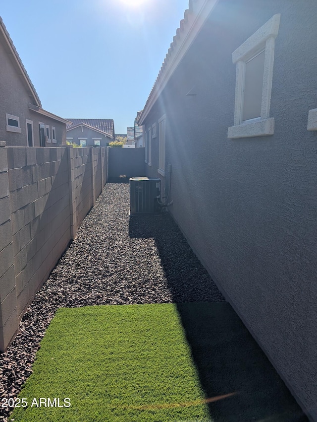 view of yard with central AC