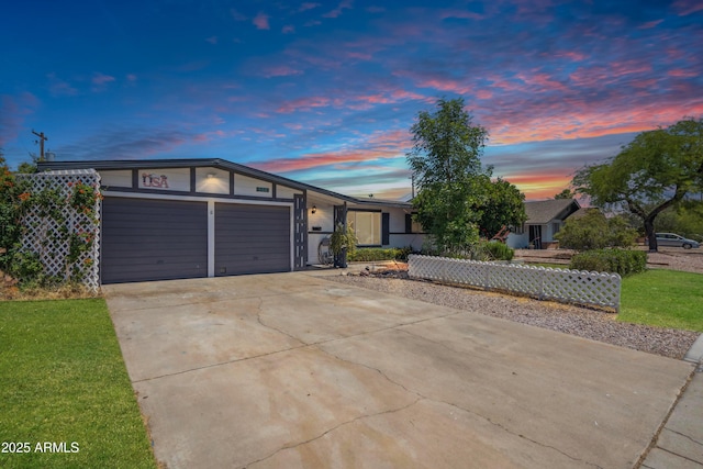 view of front of house featuring a garage and driveway