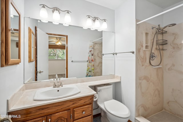 bathroom with a shower with curtain, toilet, vanity, and ceiling fan