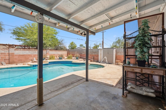 view of pool with a fenced backyard and a patio area