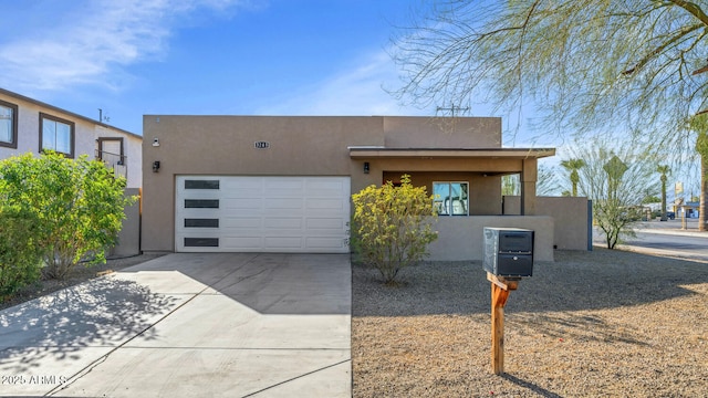 pueblo-style home featuring a garage