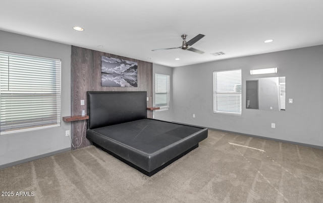 carpeted bedroom with ceiling fan