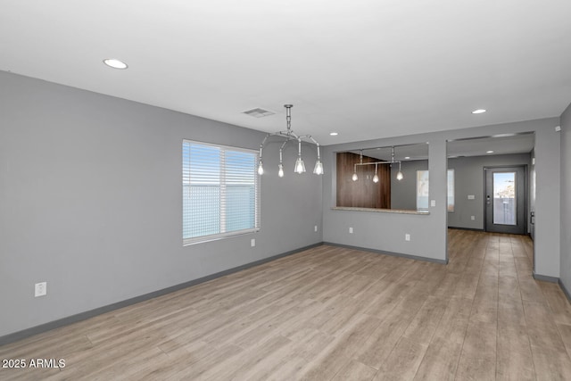 unfurnished dining area featuring light hardwood / wood-style floors