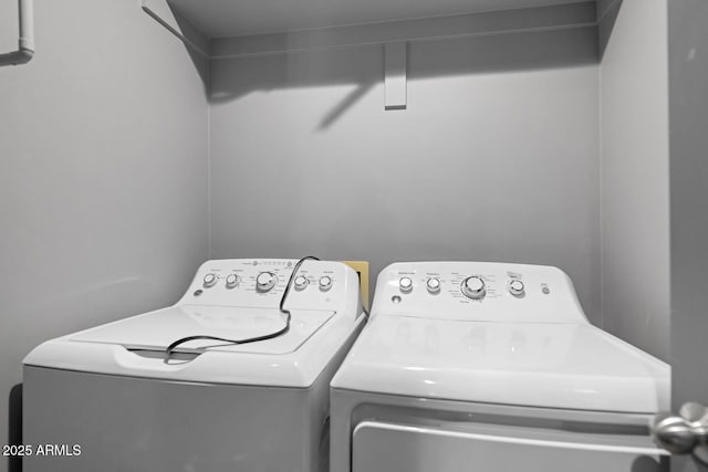 laundry room with washer and clothes dryer