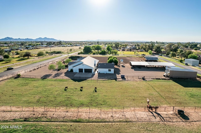 drone / aerial view featuring a mountain view and a rural view