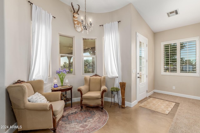 sitting room featuring a chandelier