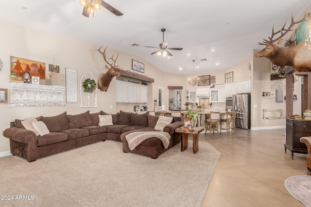 living room with a towering ceiling and ceiling fan