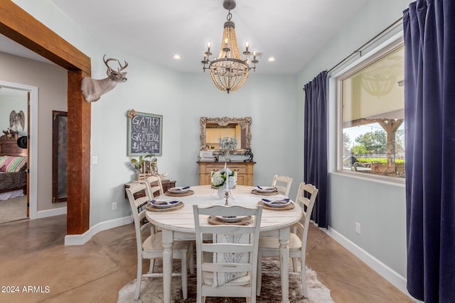 dining space featuring a notable chandelier