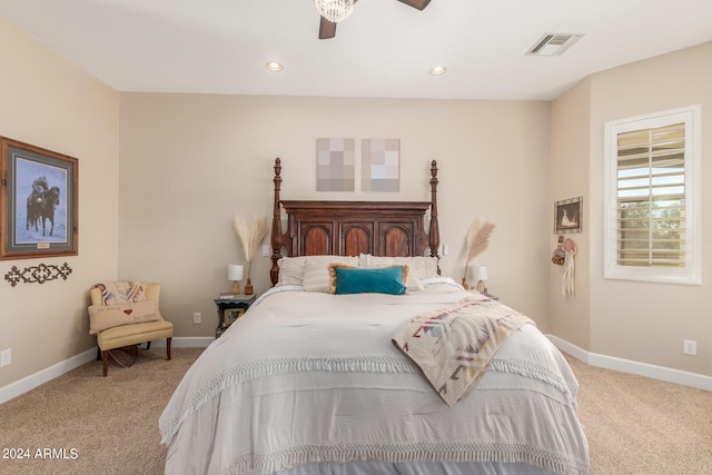 bedroom featuring light colored carpet and ceiling fan