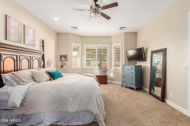 bedroom featuring ceiling fan and light colored carpet