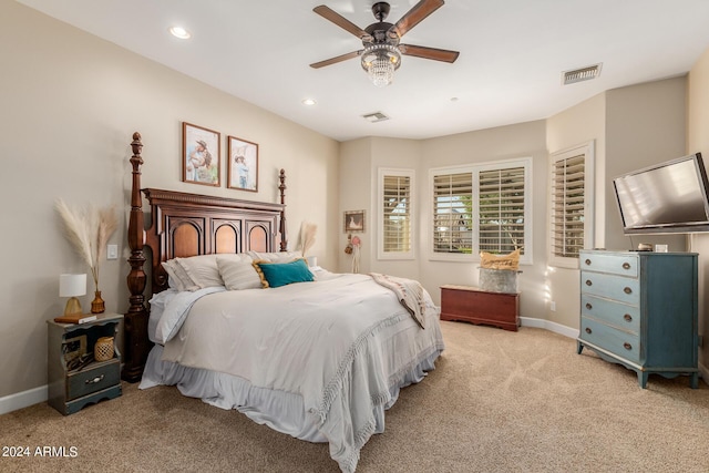 bedroom featuring ceiling fan and light colored carpet