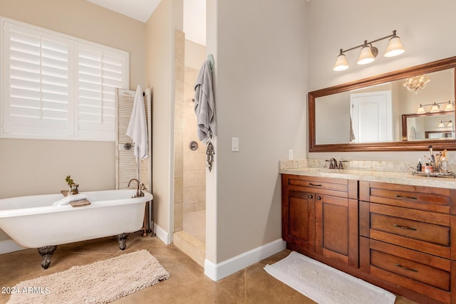 bathroom featuring independent shower and bath, vanity, and tile patterned floors