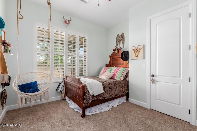 bedroom featuring light colored carpet