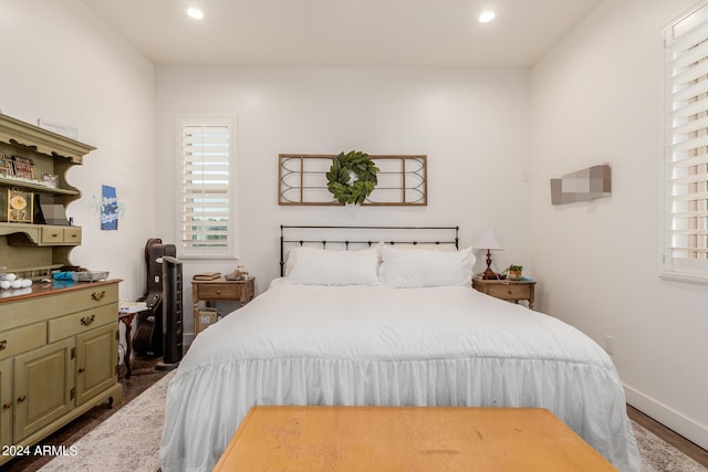 bedroom featuring dark hardwood / wood-style floors