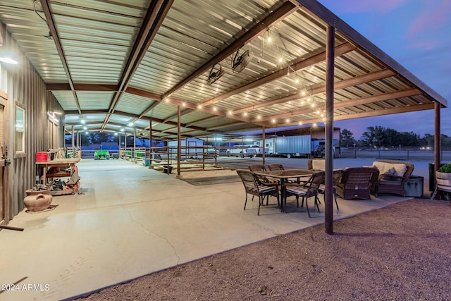 view of patio terrace at dusk