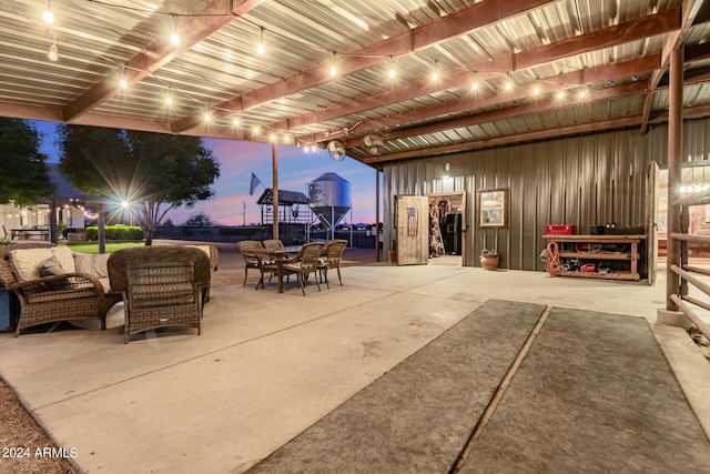 patio terrace at dusk with an outdoor living space