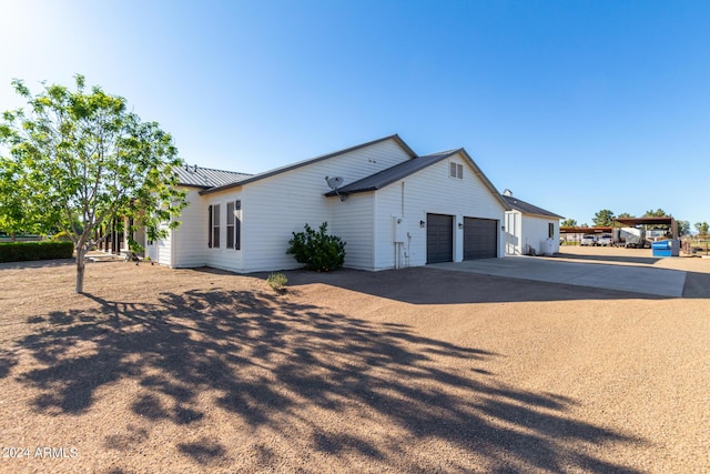 view of side of home with a garage