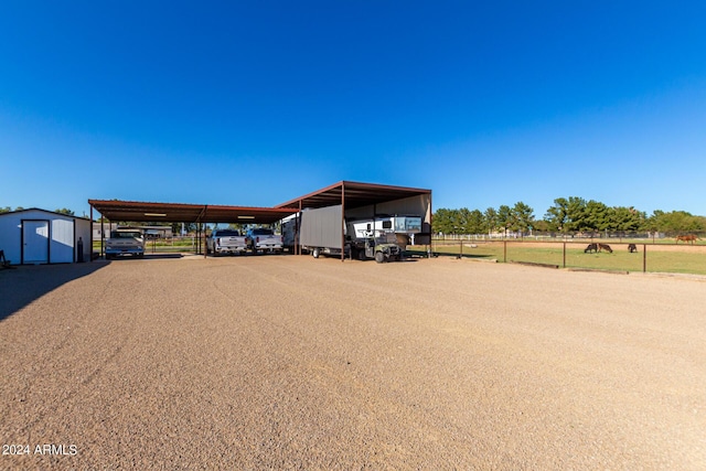 view of vehicle parking with a carport