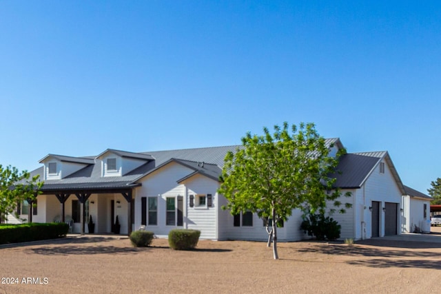 modern farmhouse style home with a garage