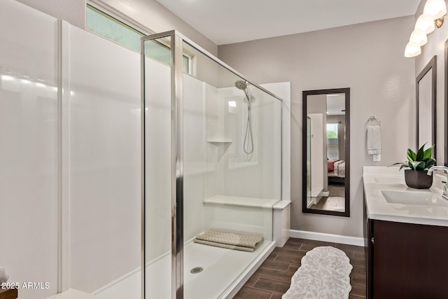 2023 W Yellowbird Ln, Phoenix, AZ 85085 - ensuite bathroom featuring a shower stall, double vanity, and wood finished floors