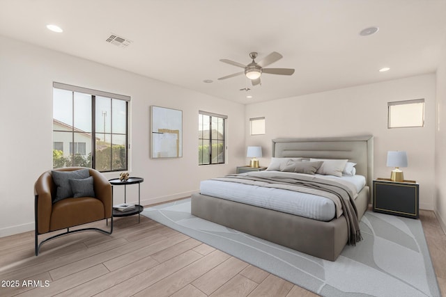 bedroom with recessed lighting, baseboards, visible vents, and light wood finished floors