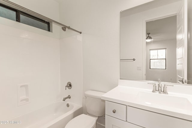 full bathroom featuring washtub / shower combination, vanity, toilet, and a ceiling fan