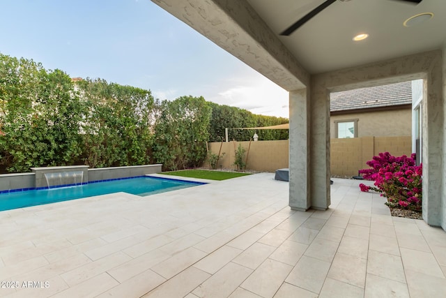 view of swimming pool featuring a patio, a fenced backyard, and a fenced in pool