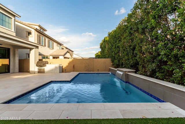 view of swimming pool with a fenced in pool, a patio area, and a fenced backyard