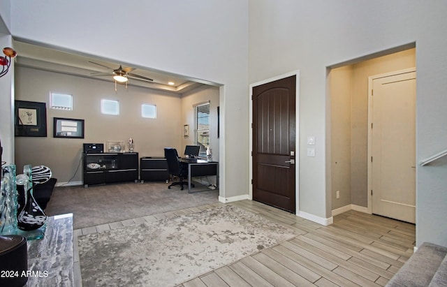 entrance foyer featuring light hardwood / wood-style flooring and ceiling fan